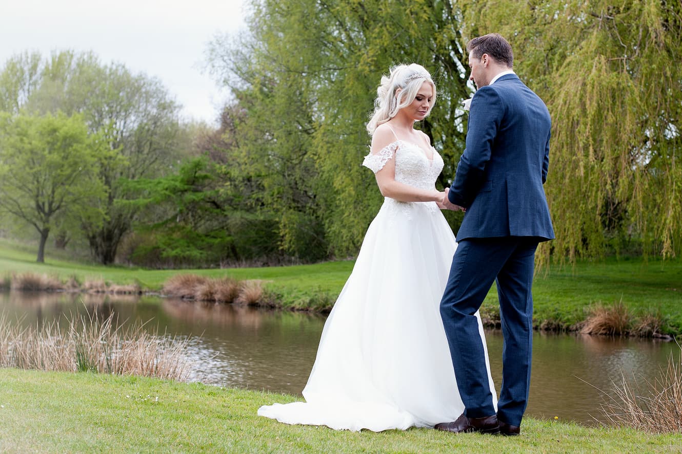 Couple embracing on the balcony on a golf course