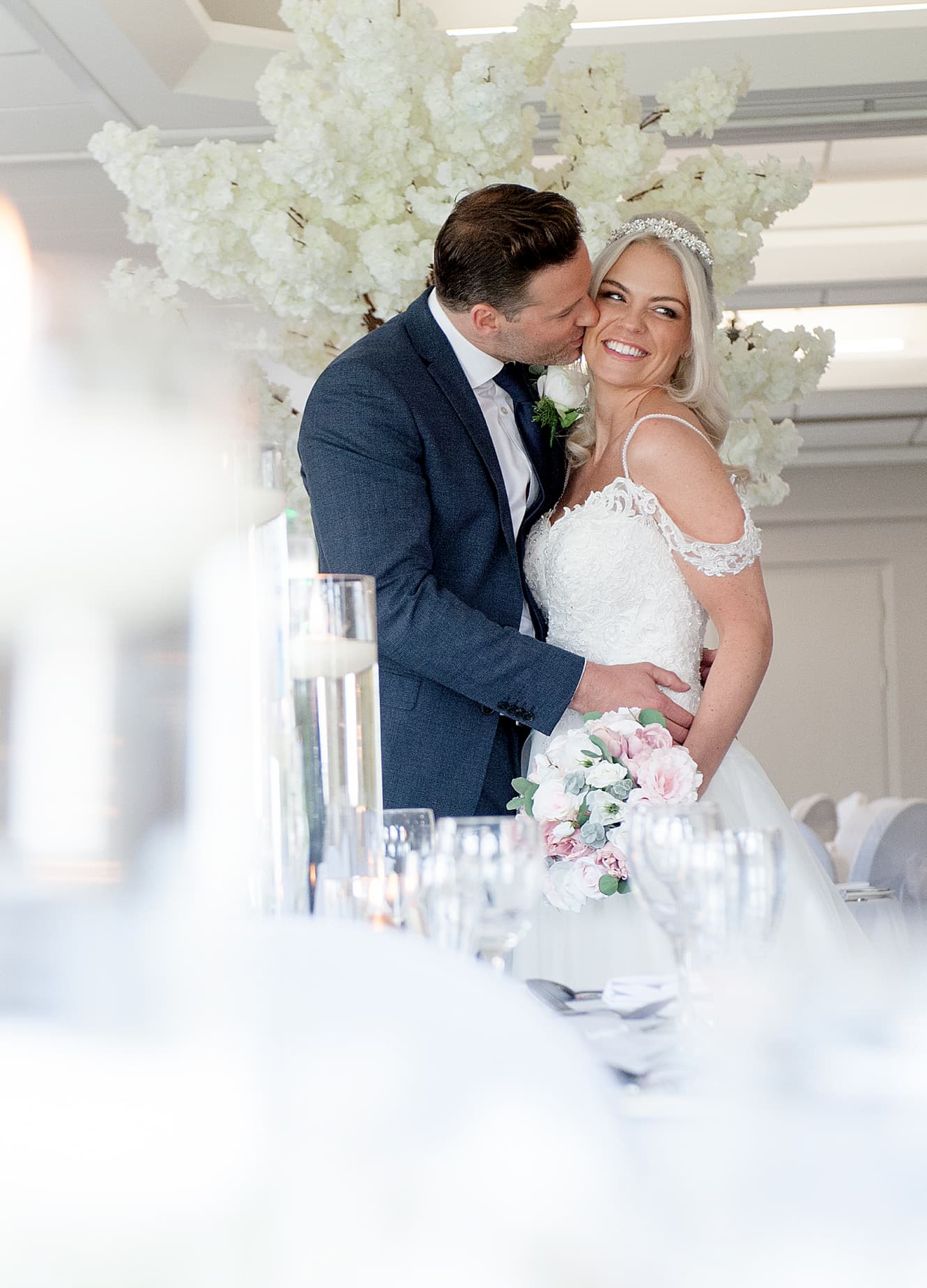 Couple embracing on the aisle during their wedding day