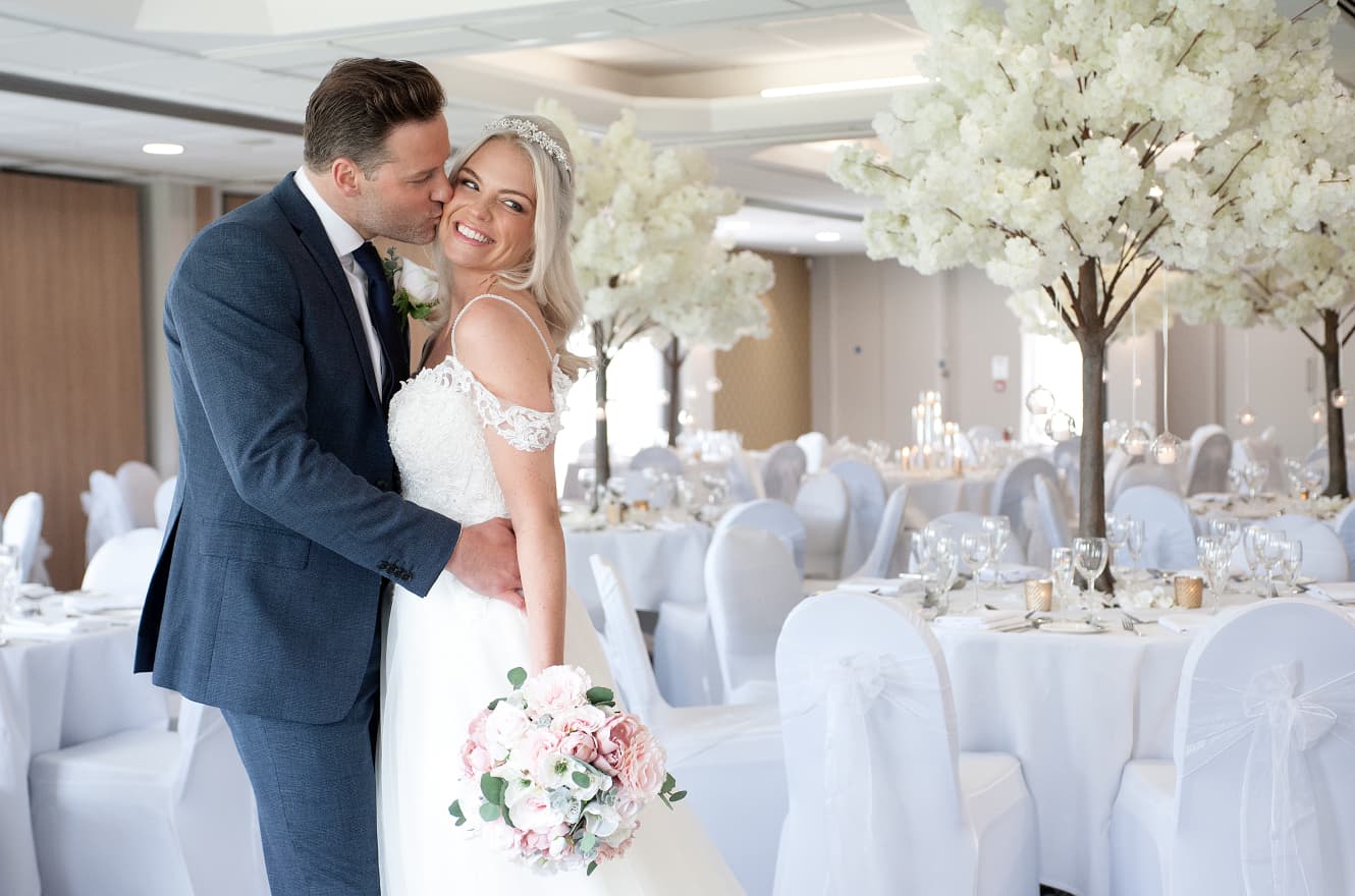 Couple enjoying their wedding day with full dining decoration